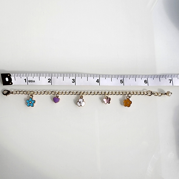 Charm bracelet. 6 inches with 1 inch extender. Gold w/ colorful charms. - Picture 4 of 5